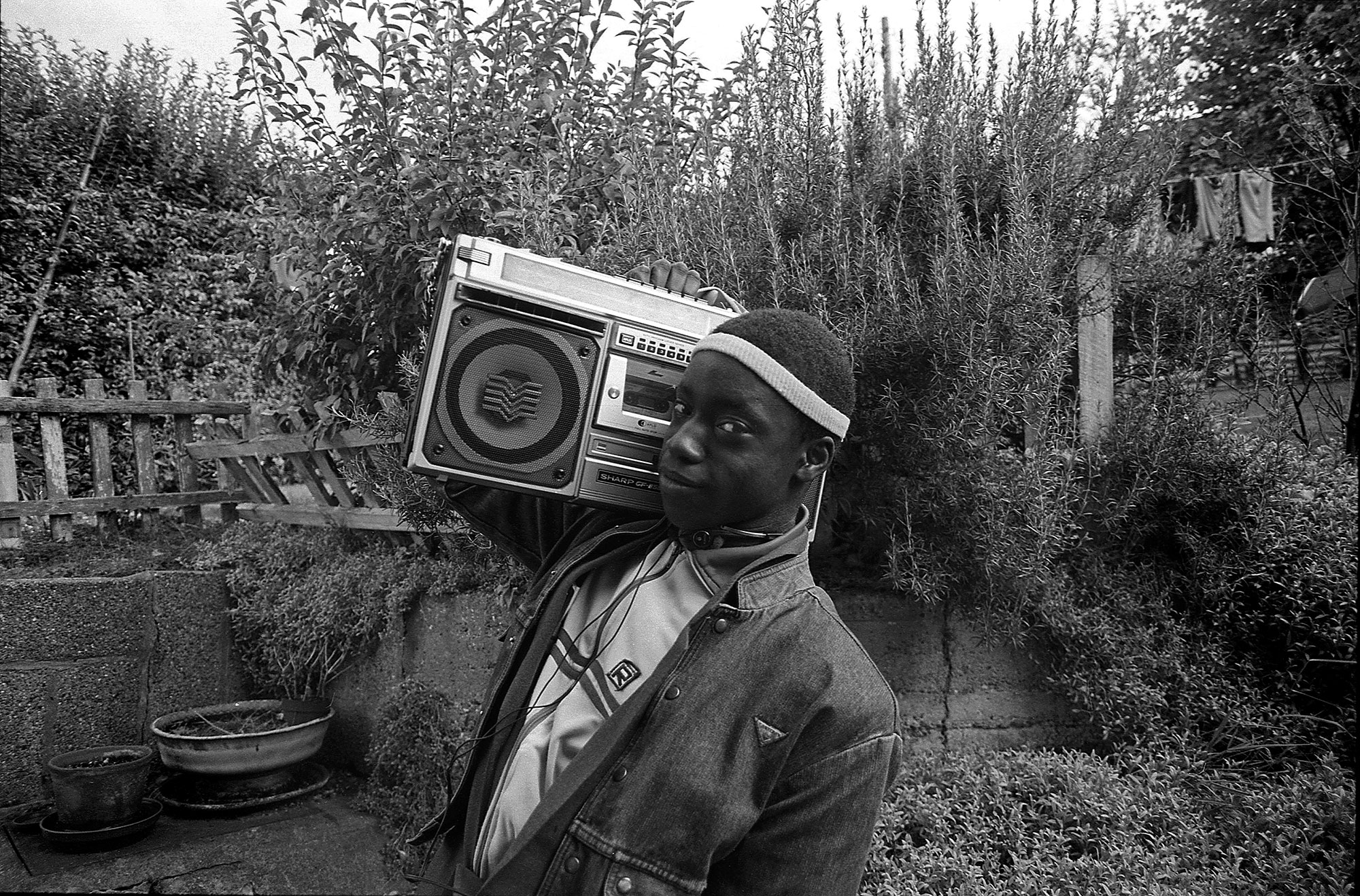 Gavin Watson 'Barry George and Boombox, High Wycombe' 1983, black and white photograph on gloss paper, Courtesy the artist