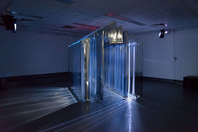 Image of abstract mirror installation in a dark room