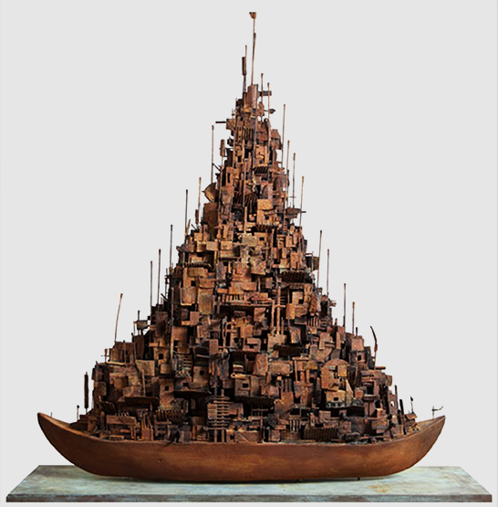 A cardboard sculpture of a boat with makeshift housing