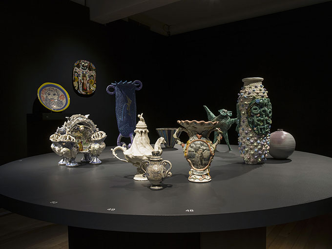 Installation view of ceramics on table in QUT Art Museum