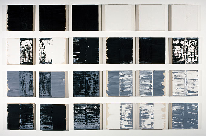 Painting of 24 squares with shades of black, blue/black, blue/white, blue/black