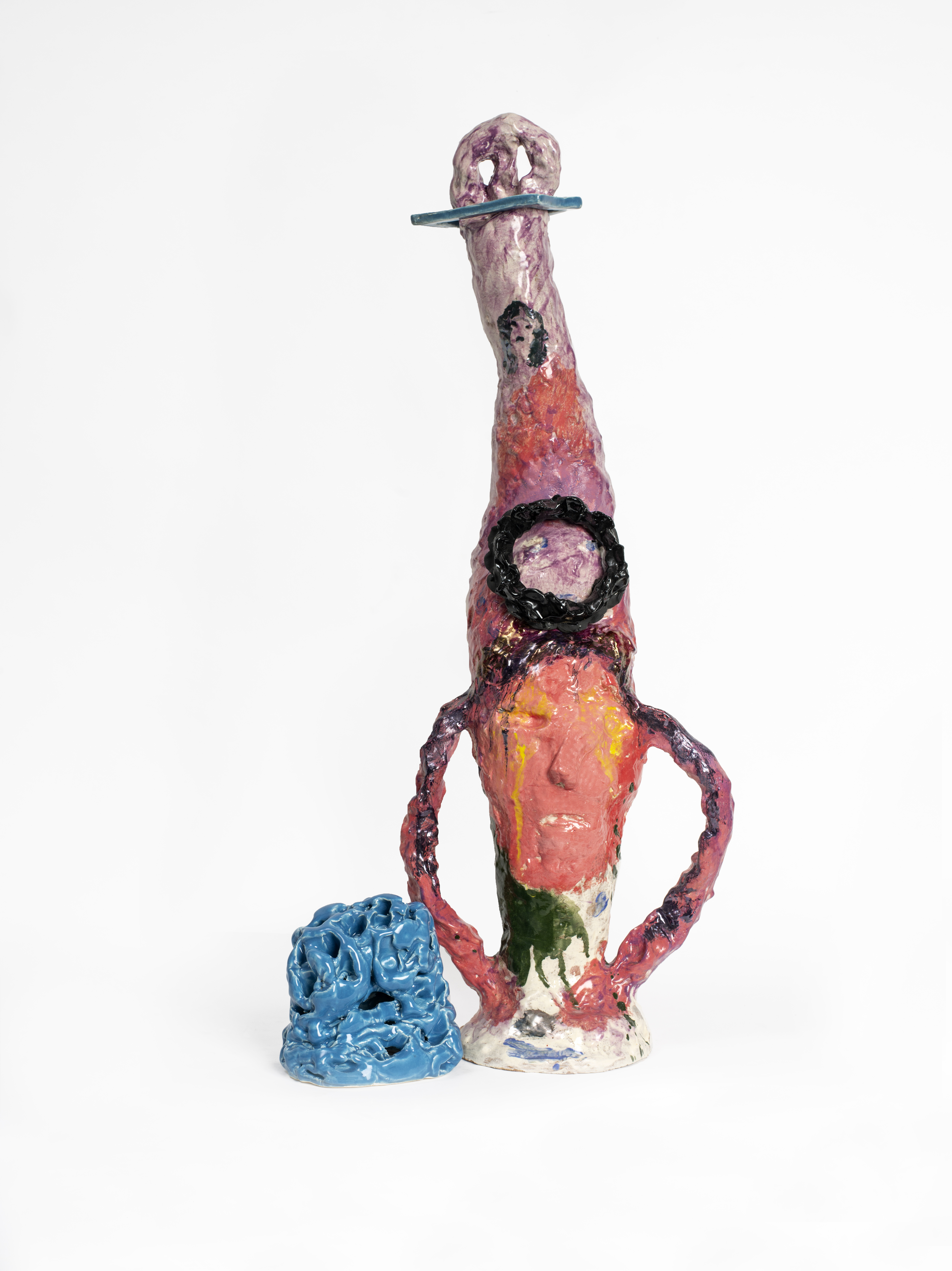 A brightly coloured abstract ceramic sculpture.