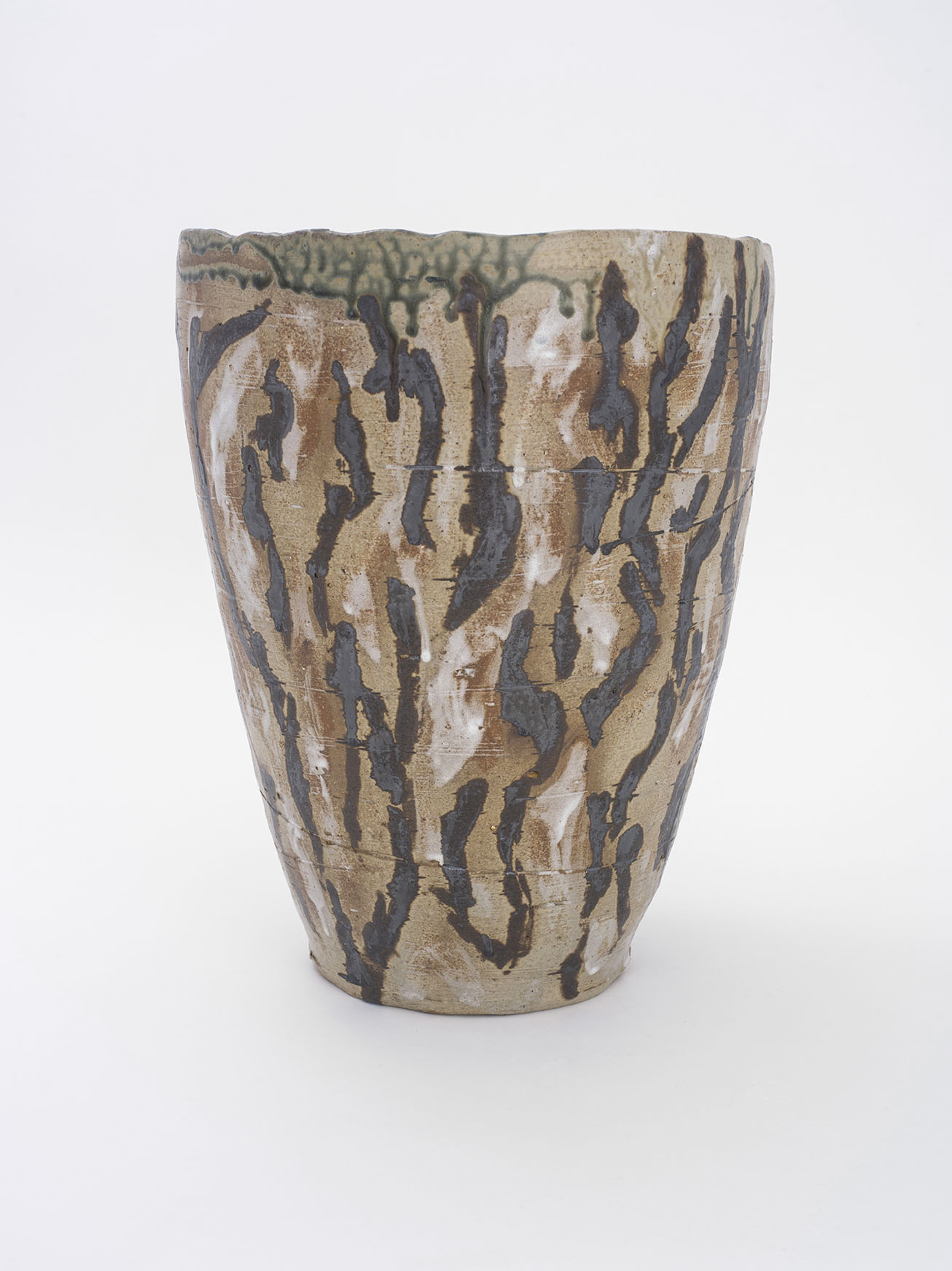 Tall stoneware pot with brown glazes applied in abstract brushtrokes