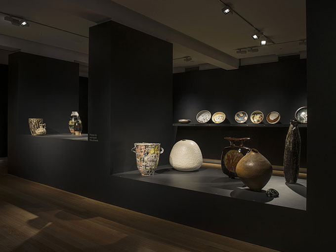 Installation view of ceramics on table in QUT Art Museum