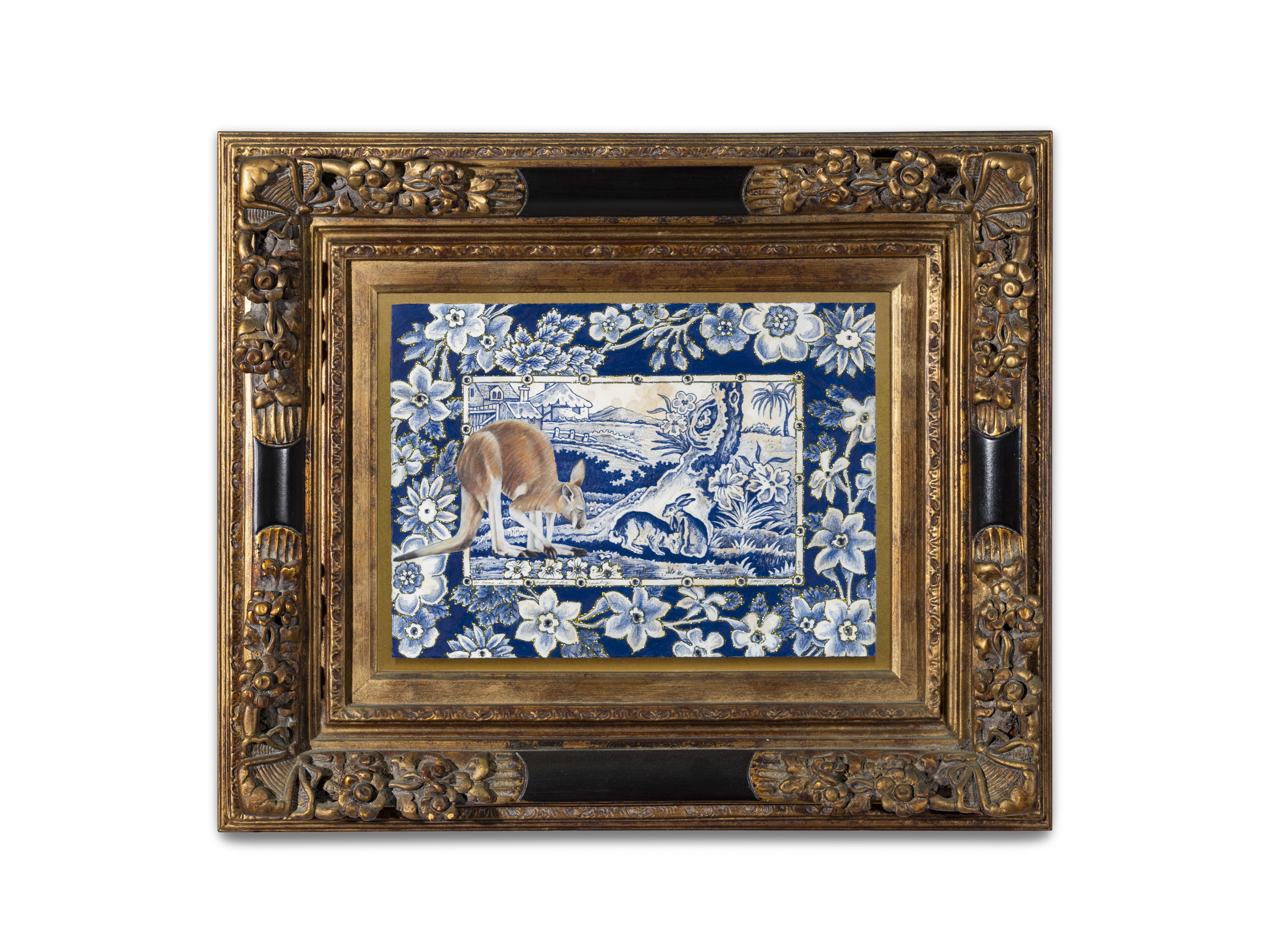 A colour illustration of a kangaroo overlaid on a pastoral scene depicted in blue-and-white, similar to those found on decorative dinnerware. The picture is framed in an ornate gold frame.