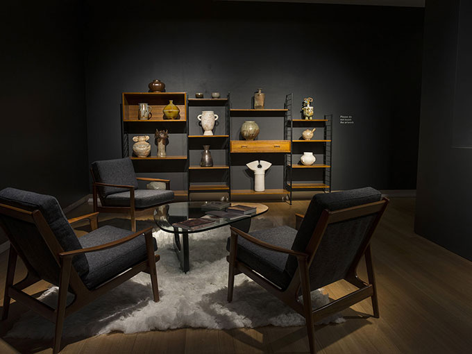 Installation view of ceramics on table in QUT Art Museum